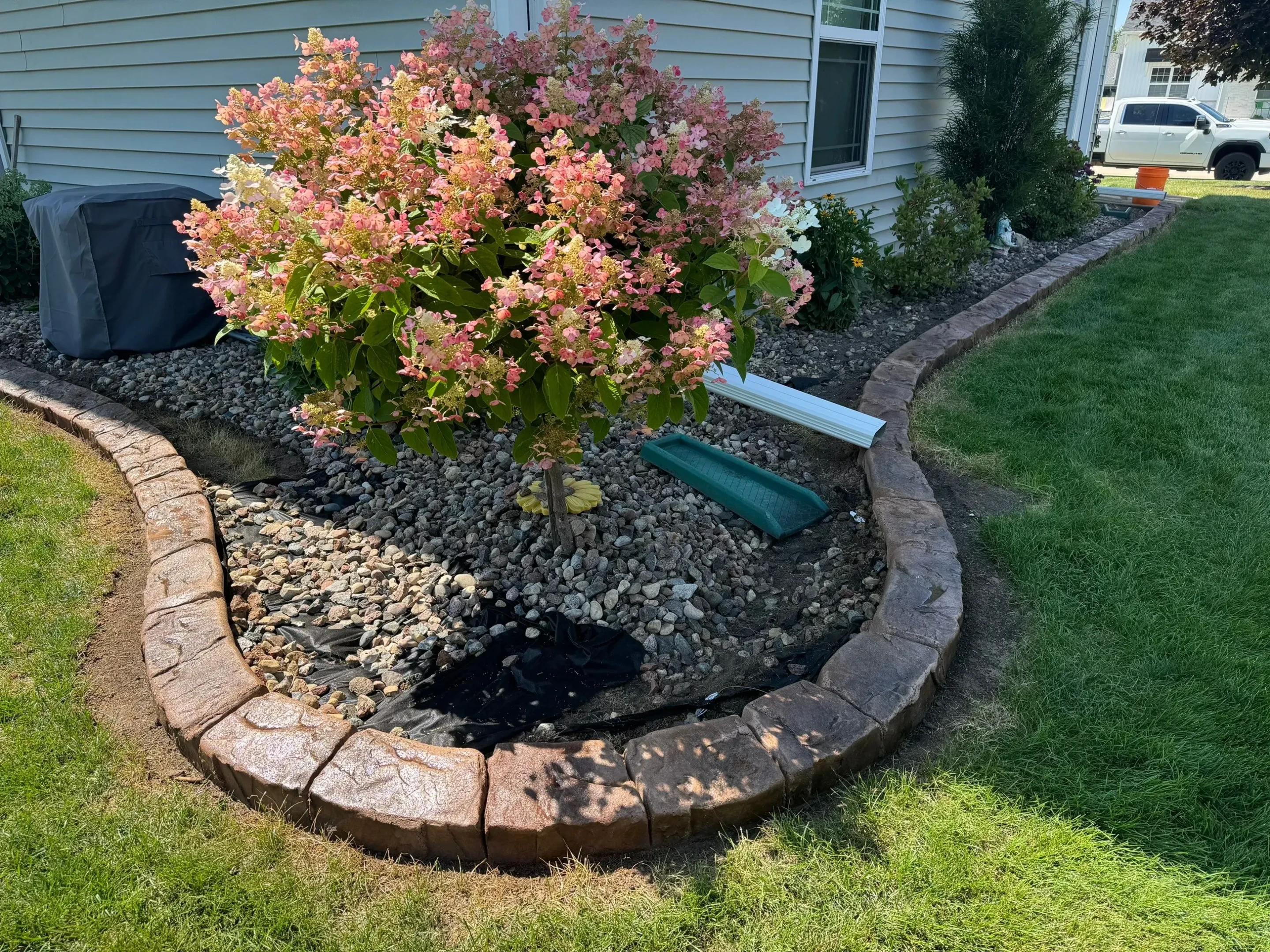 Next Level Curb Appeal Decorative Natural Stone Curb in St. Cloud